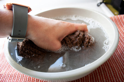 Gently squeeze your item in the soapy water to wash