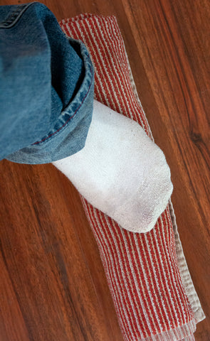 Stepping on your rolled up towel helps get even more water out