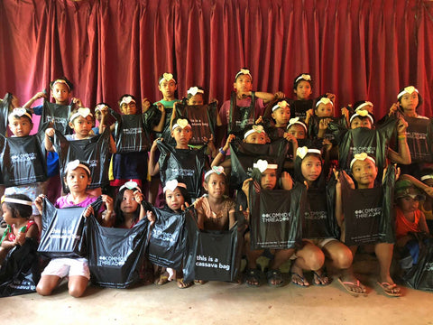 The children of the Damagat tribe in Mount Paliparan Rizal hold their CommonThread Philippines cassava biobags custom made by EcoNest Philippines