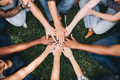 Hands together in circle