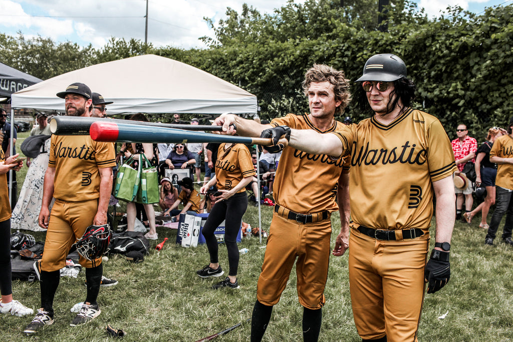 Jack White and Brendan Benson of the Warstic Woodmen comparing bats