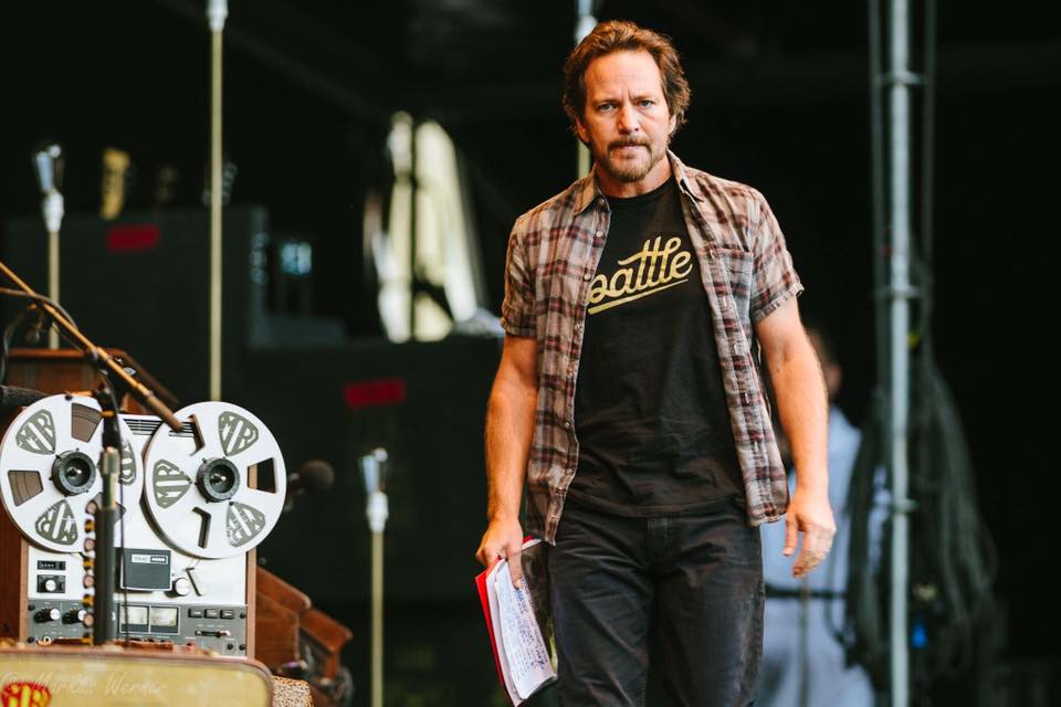 Eddie Vedder wearing the Warstic Battle Tee on stage