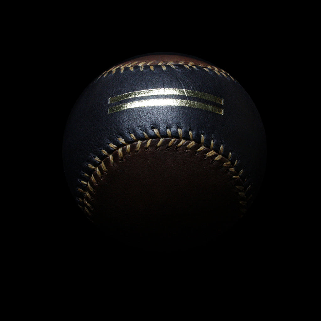 View of the Warstripe logo embossed in gold on the black leather of the Warstic Official #3 Sandlot Baseball