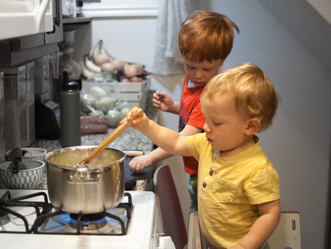 Two boys cooking in the kitchen