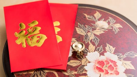 Chinese New Year red envelopes on table
