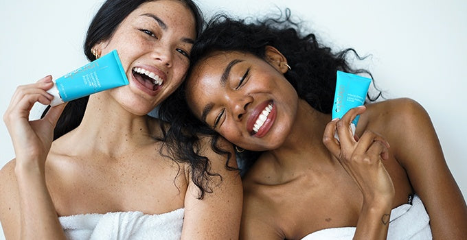 Two women holding Epicuren products