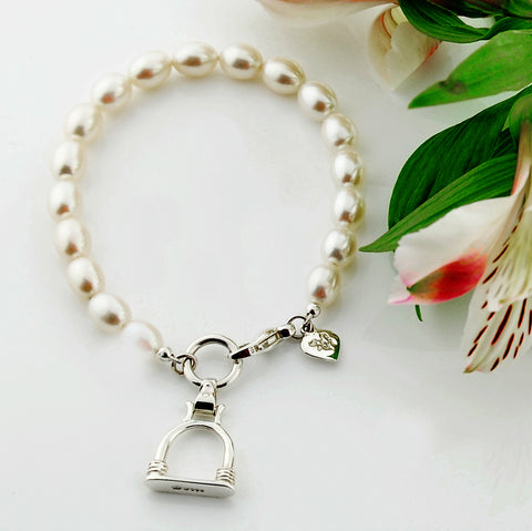 Solid silver and cultured pearl bracelet with stirrup inspired charm