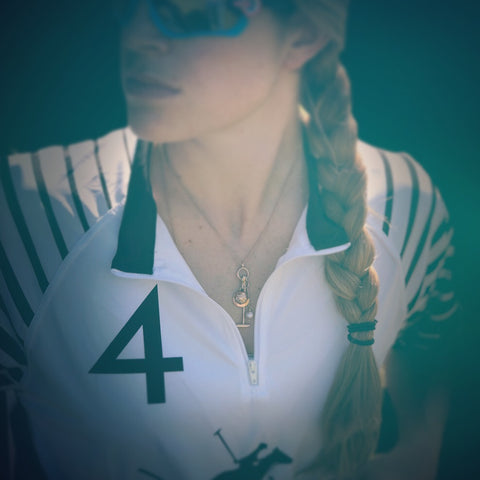 girl wearing gold, pearl and diamond polo necklace