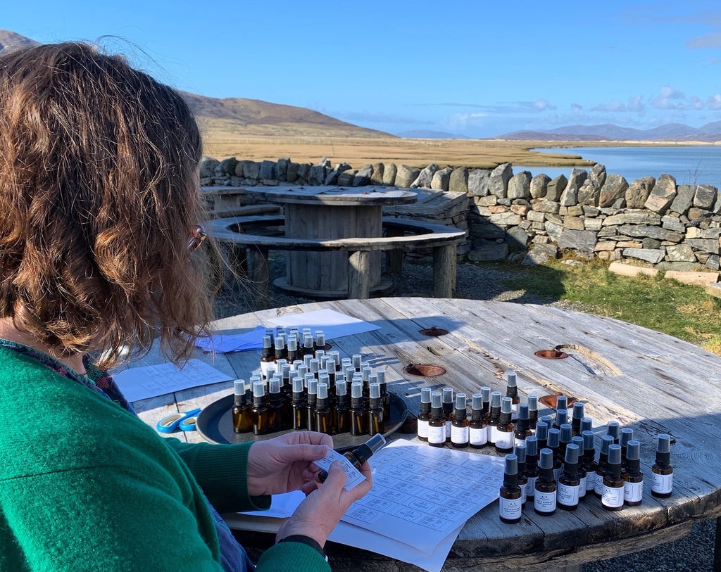 Amanda labelling her bottles in the village of Northton, south Harris.
