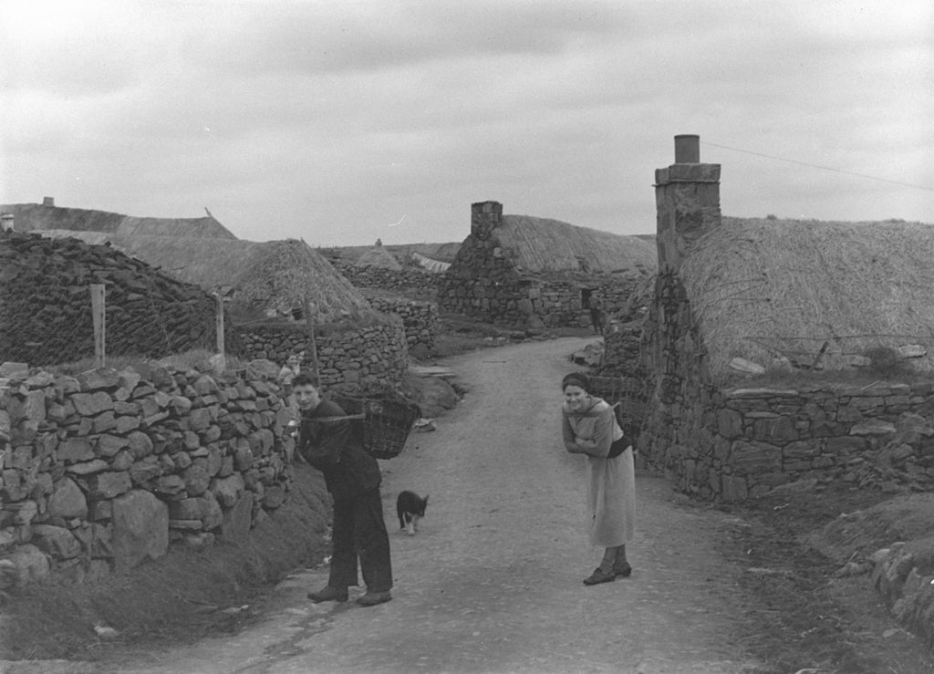 A blackhouse village and bringing creels of peat home for the fire.