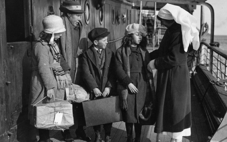 A nurse inspecting children from the Outer Hebrides on board the Canadian Pacific ship the SS Marloch, April 1924. © Getty Images
