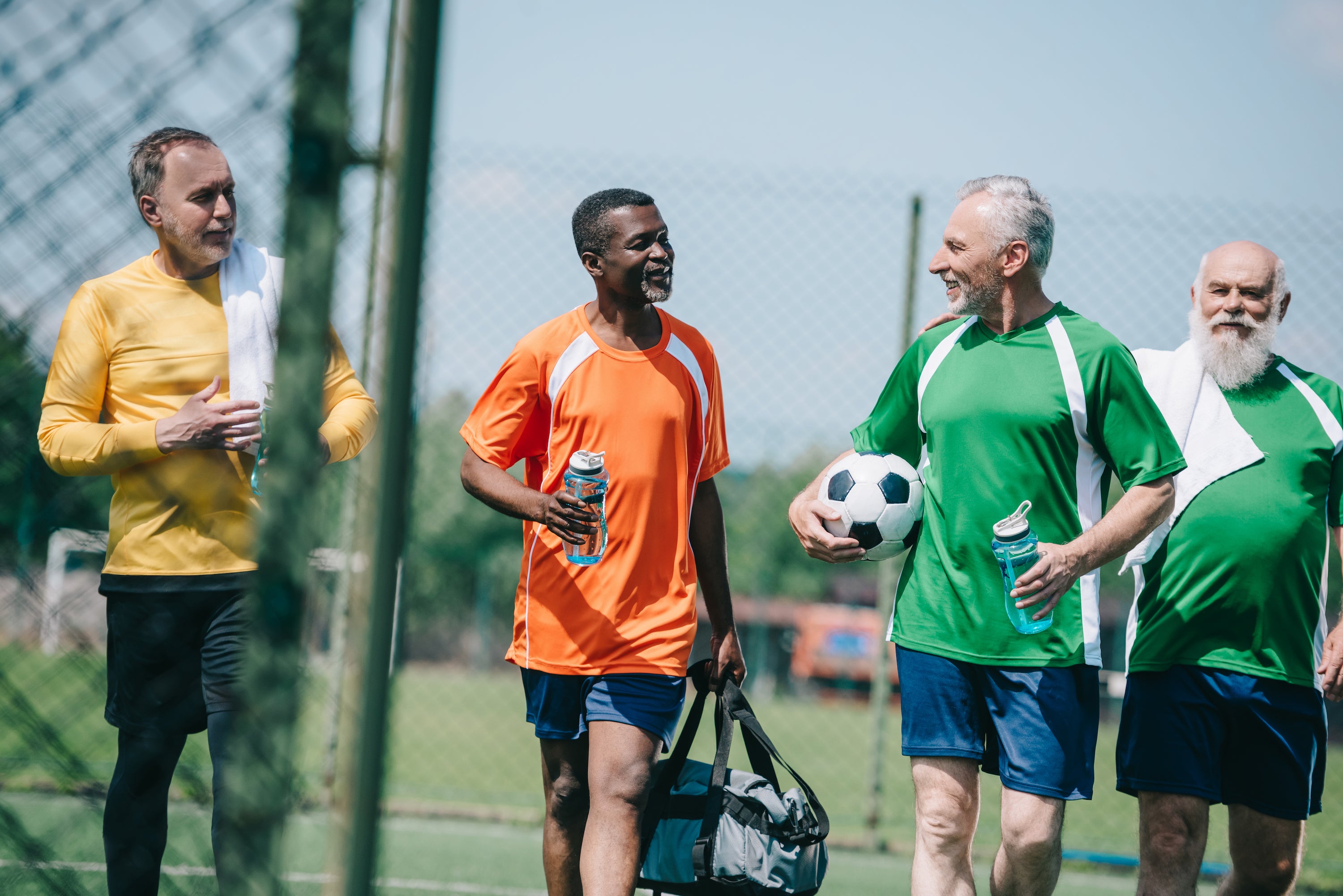 group of men talking after soccer game