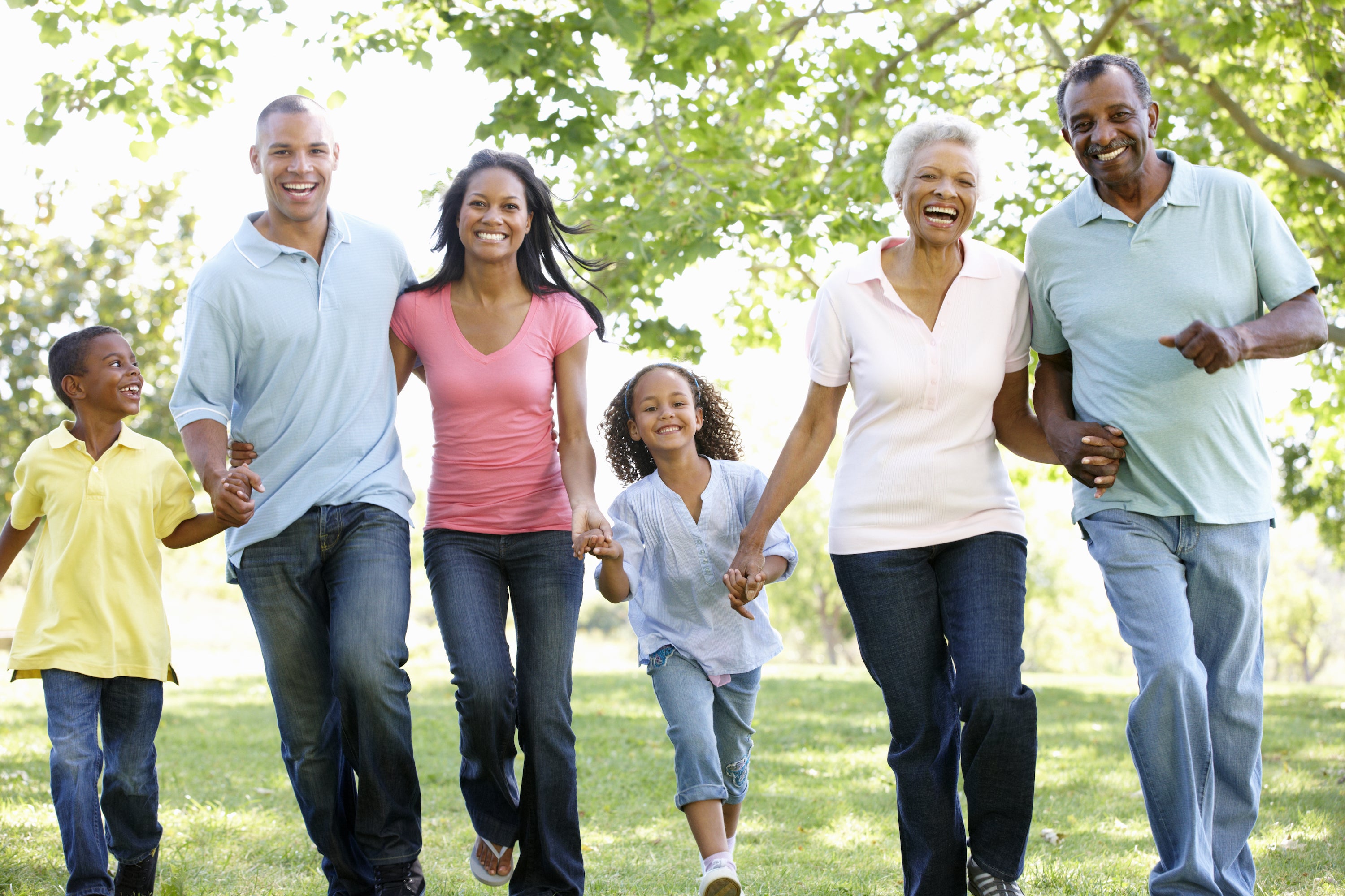 multigenerational family walking in park