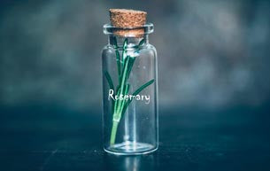 Rosemary Oil in a glass bottle