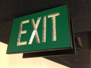 Double sided green exit sign