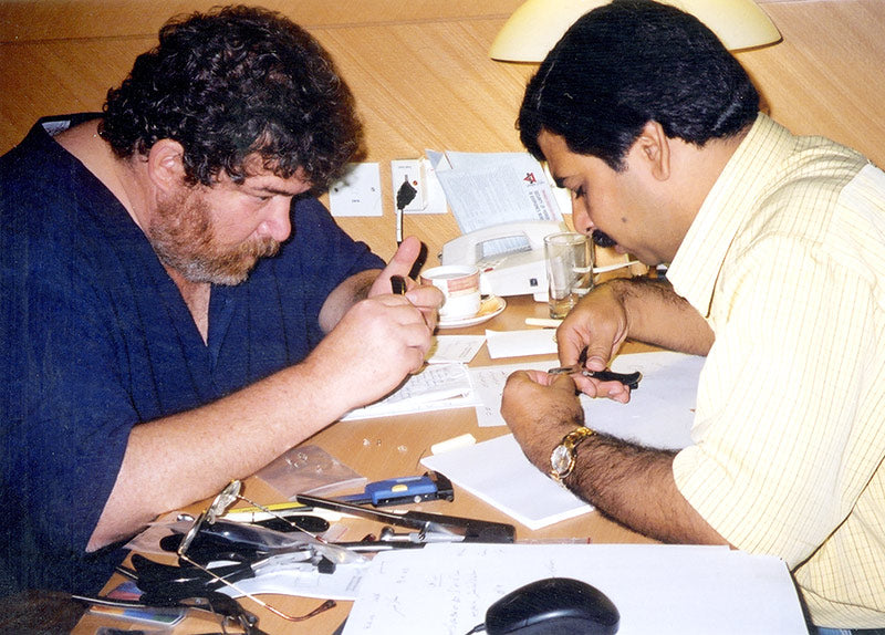 Joshua Freilich designing new tools with Western Optical's Pakistan facility Director in Hong Kong, 2003