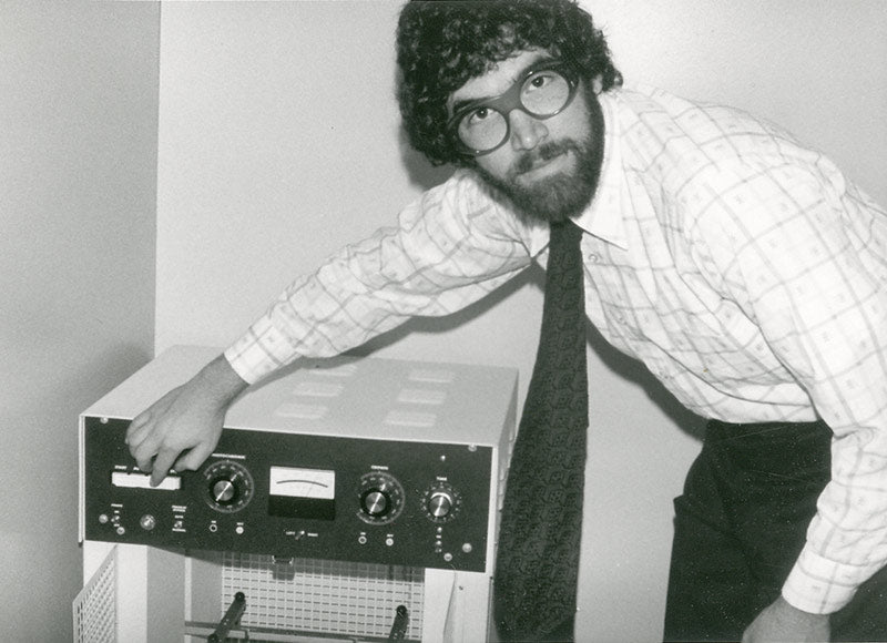 Joshua Freilich servicing chemical hardener equipment in 1975