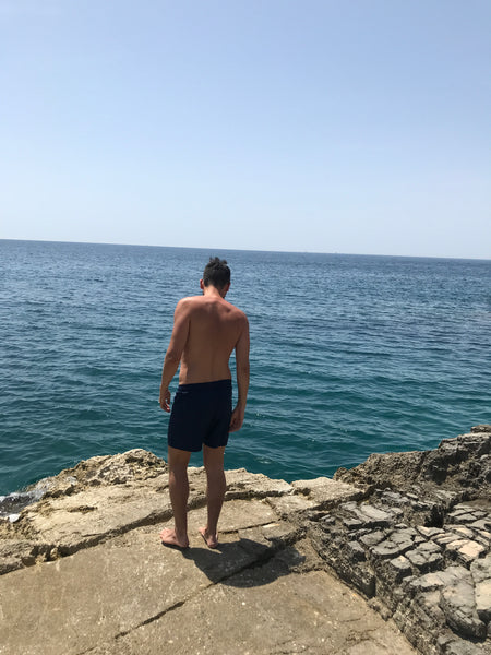 Man in Copper Bottom Swim shorts at Cape Kamenjak, Croatia