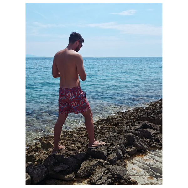 Man in Copper Bottom Swim trunks standing near water at Cape Kamenjak, Croatia