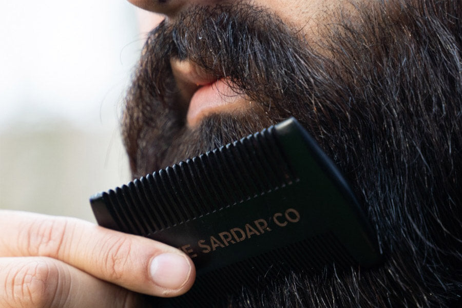 beard comb gliding through beard