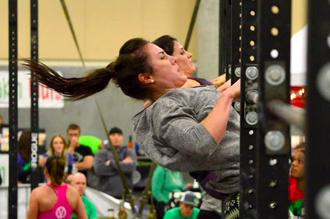 Emily Beers doing chest to bar pull-ups at a CrossFit competition