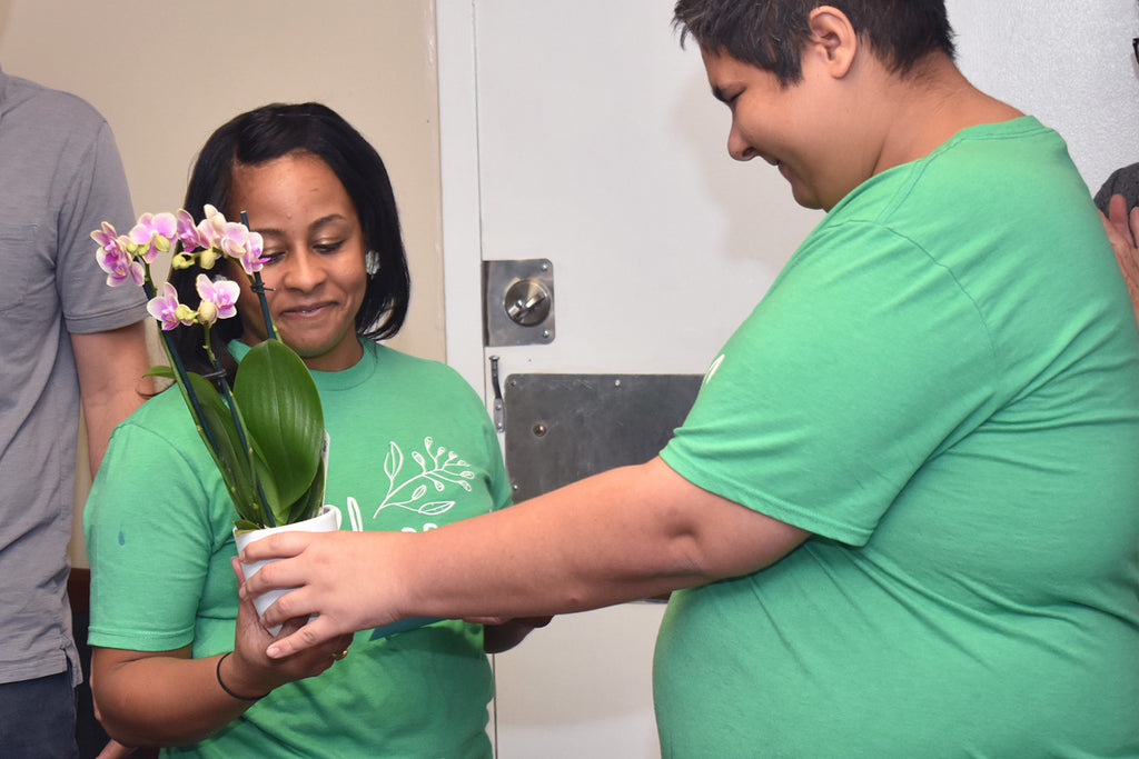 Crystal Julsaint is honored by Blossom crafters at a recent staff party.