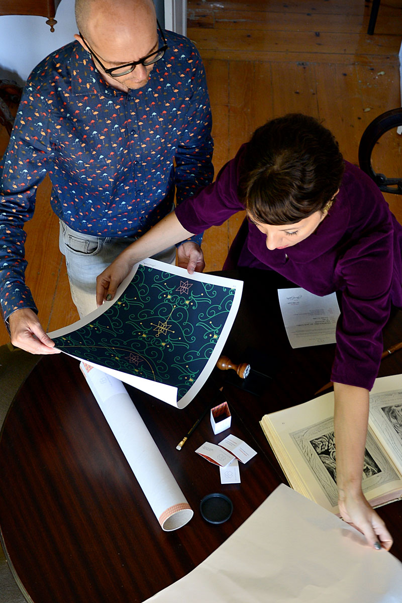 The artists Chiara and Spiros preparing the print for shipping