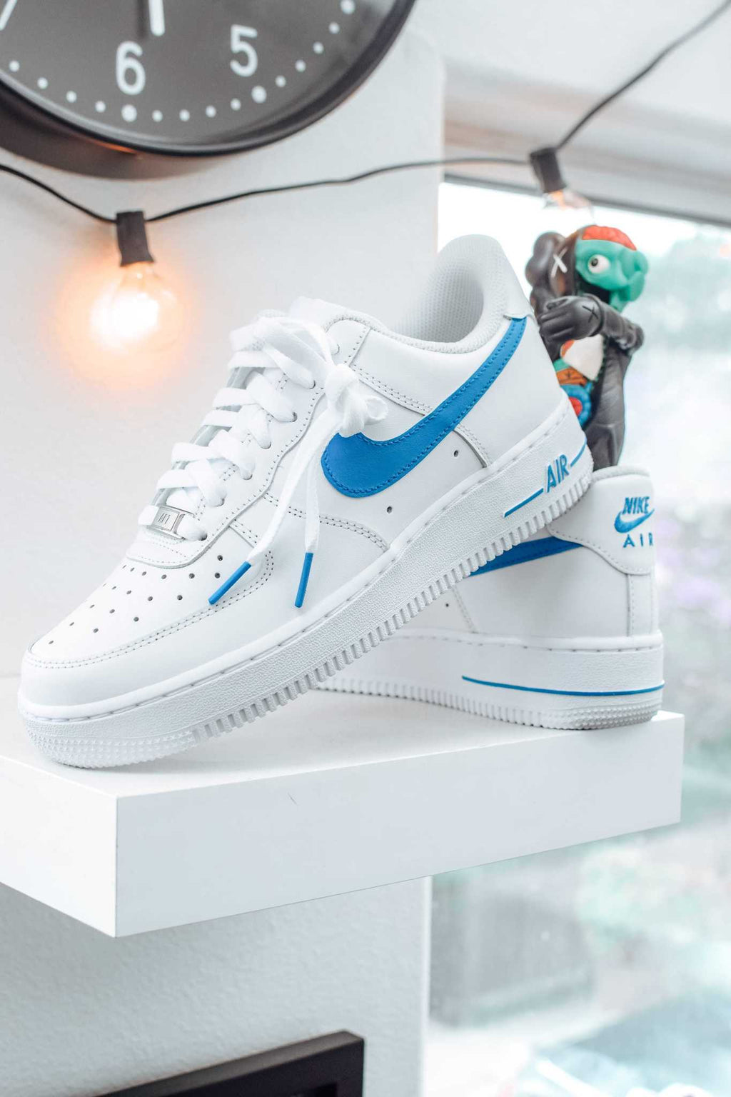 white nike with light blue swoosh