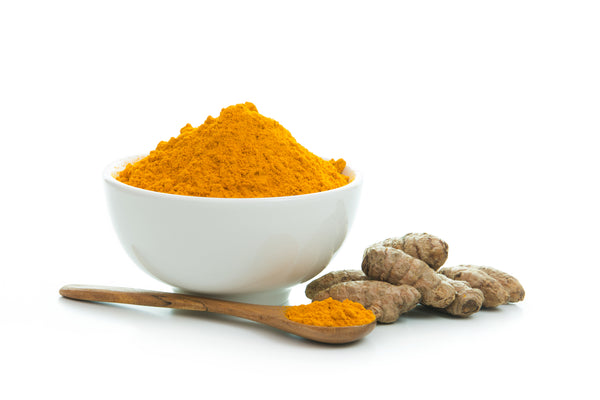 Organic Ground Turmeric and Root in a white bowl