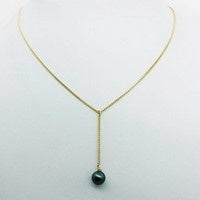 collier or avec perle noire