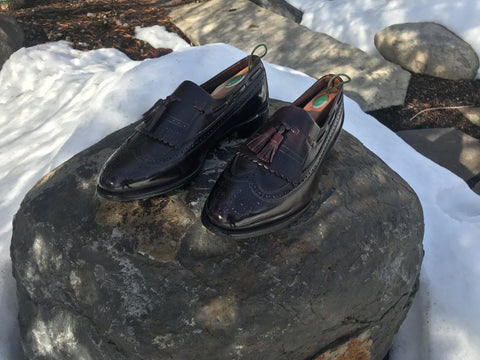 Beautiful Merlot Allen Edmonds Arlington Loafers on a rock in the snow turned forwards