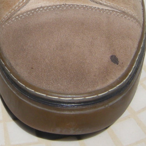 Small spot of oil on the toe of a suede shoe