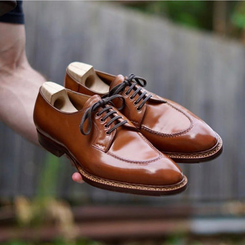 Saint Crispins Natural Shell Cordovan Apron Toe Derbies being handled by DE Shellvedge