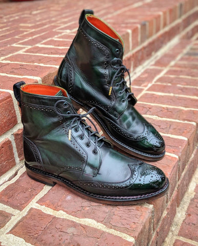 Wingtip Wednesday Allen Edmonds Dalton Boots with custom green patina and mirror shine - sitting on bricks