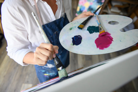 Painting a canvas, abstract art, acrylic paint