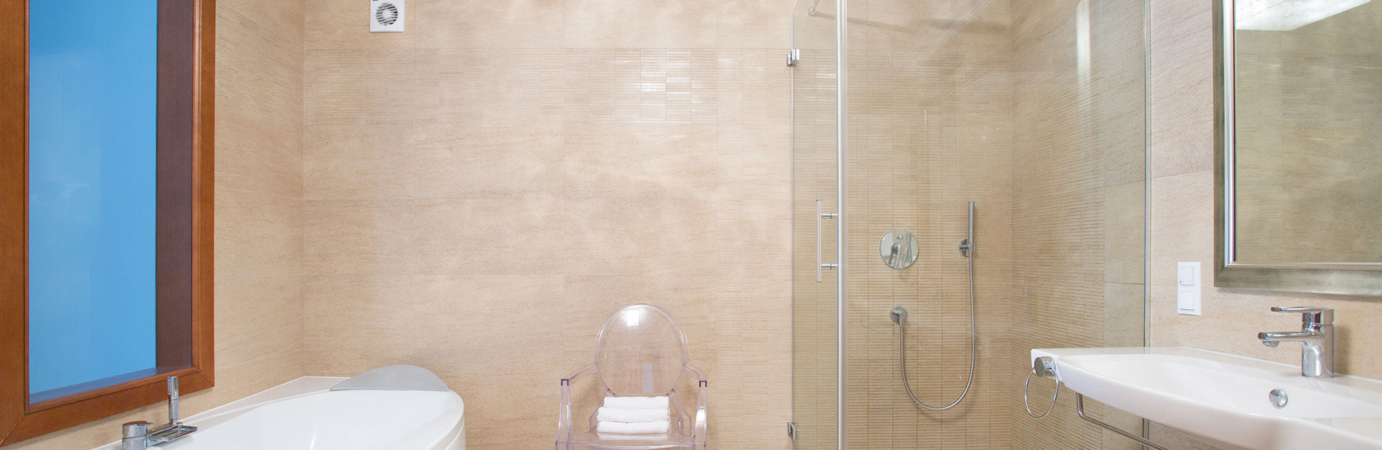 Glass shower enclosure and vanity mirrors