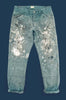 A pair of worn and torn chore pants