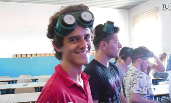 smiling man and others wearing simulation goggles
