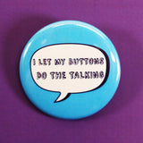 Blue fashion pin 'I let my buttons do the talking'