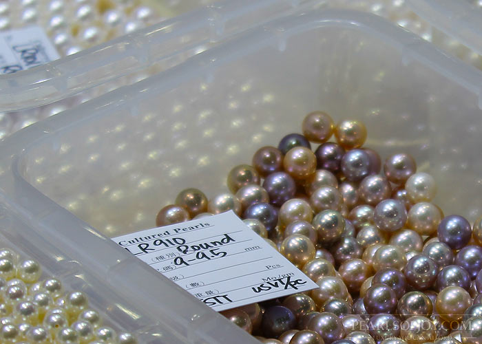 a tray of metallic pearls