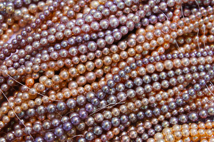 assorted colored strands of metallic pearls