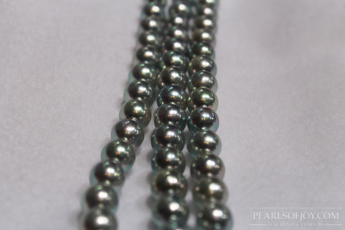 close up strands of akoya pearls