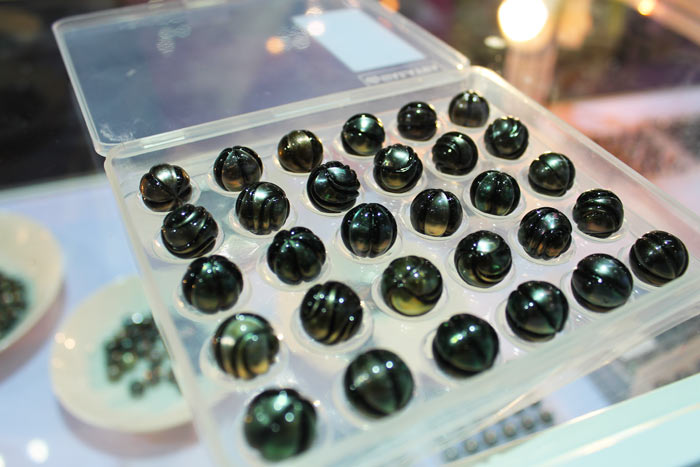 a tray of beautifully carved Tahitian pearls