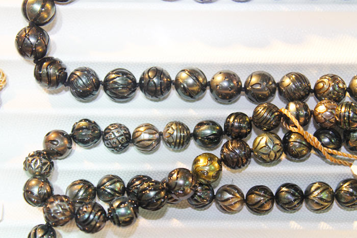 a strand of Galatea pearls with different patterns