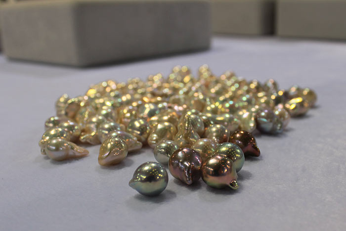 a group of golden baroque pearls