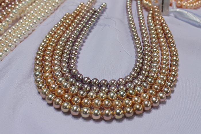 strands of pearls with metallic luster