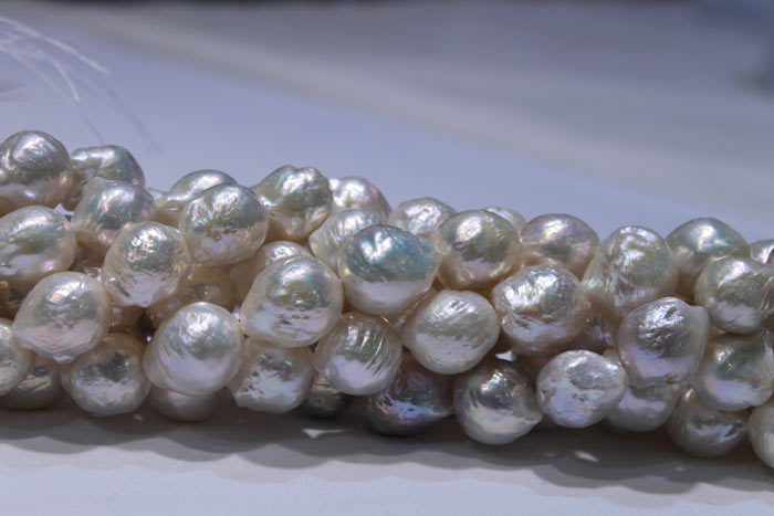 a close up of the huge, white pearls