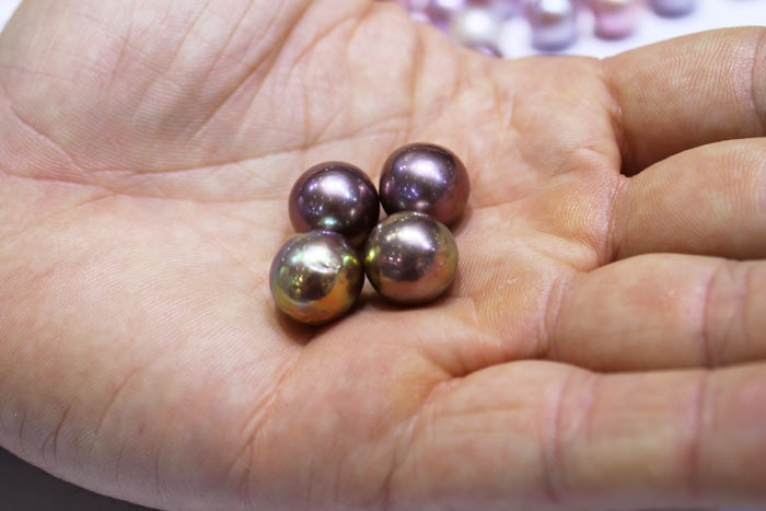 two pairs of perfectly matched pearls