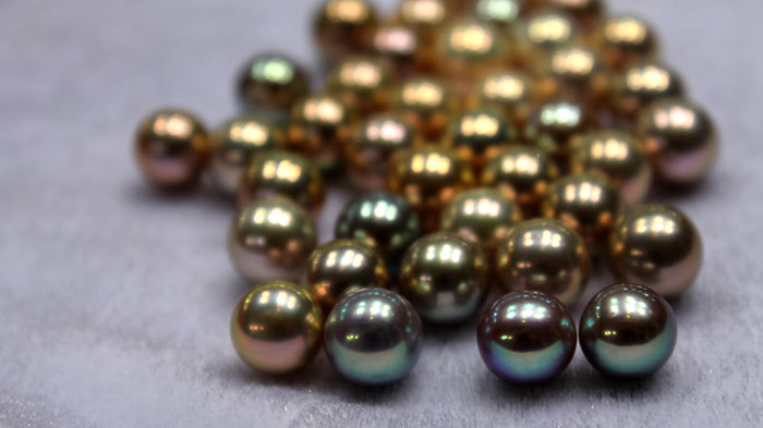 close up of a group of metallic pearls