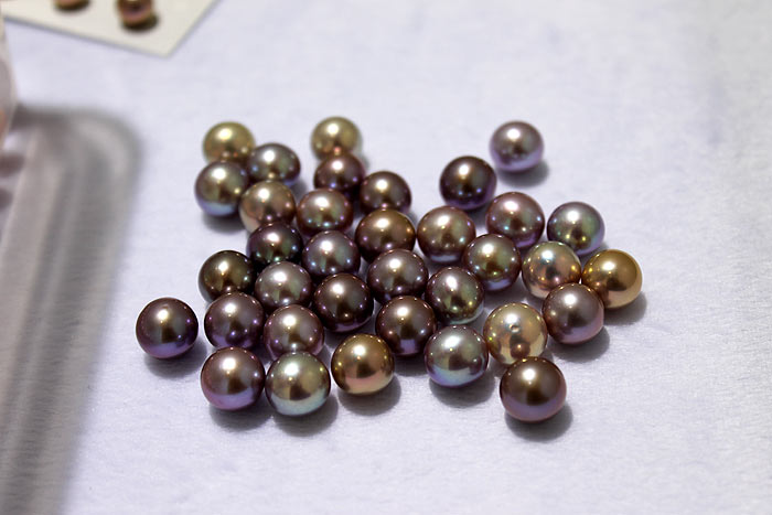 a group of dark purple pearls